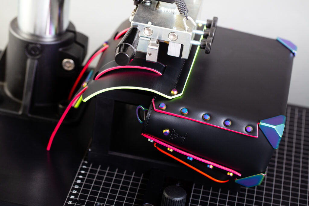 KSF 4 machine being used to press image onto a black leather bag