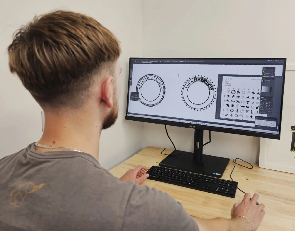 A member of the artwork team preparing files